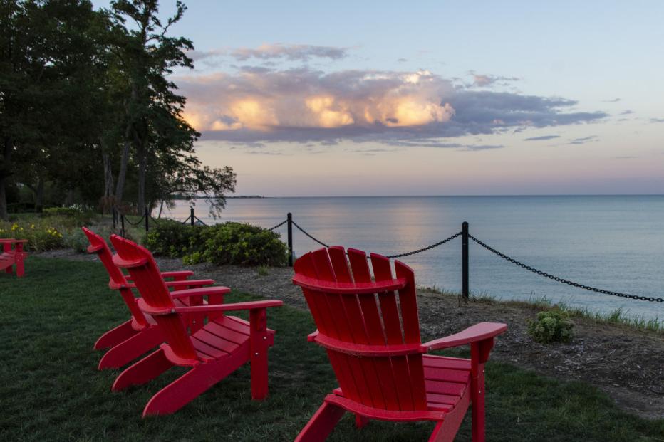 Red chairs along Lake Michigan